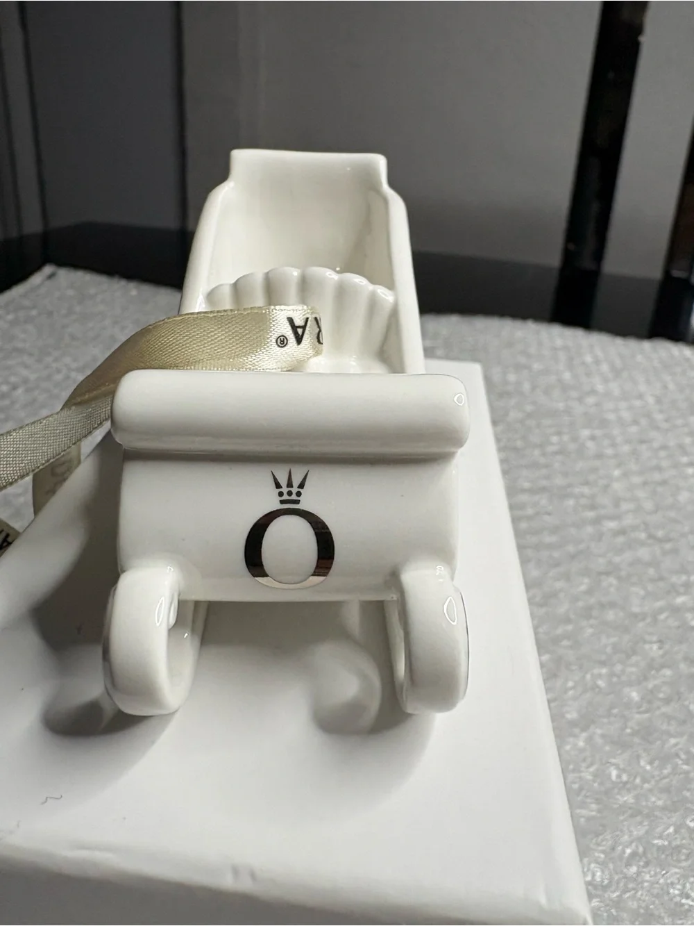 Pandora white porcelain sleigh ornament